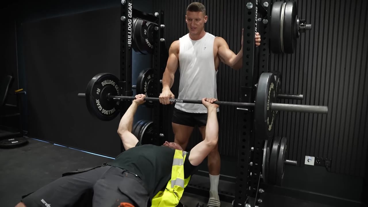 Construction workers compete to find the strongest bench presser