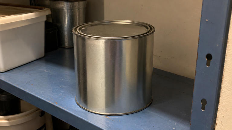 Why do some paint cans have small holes in the rim?
