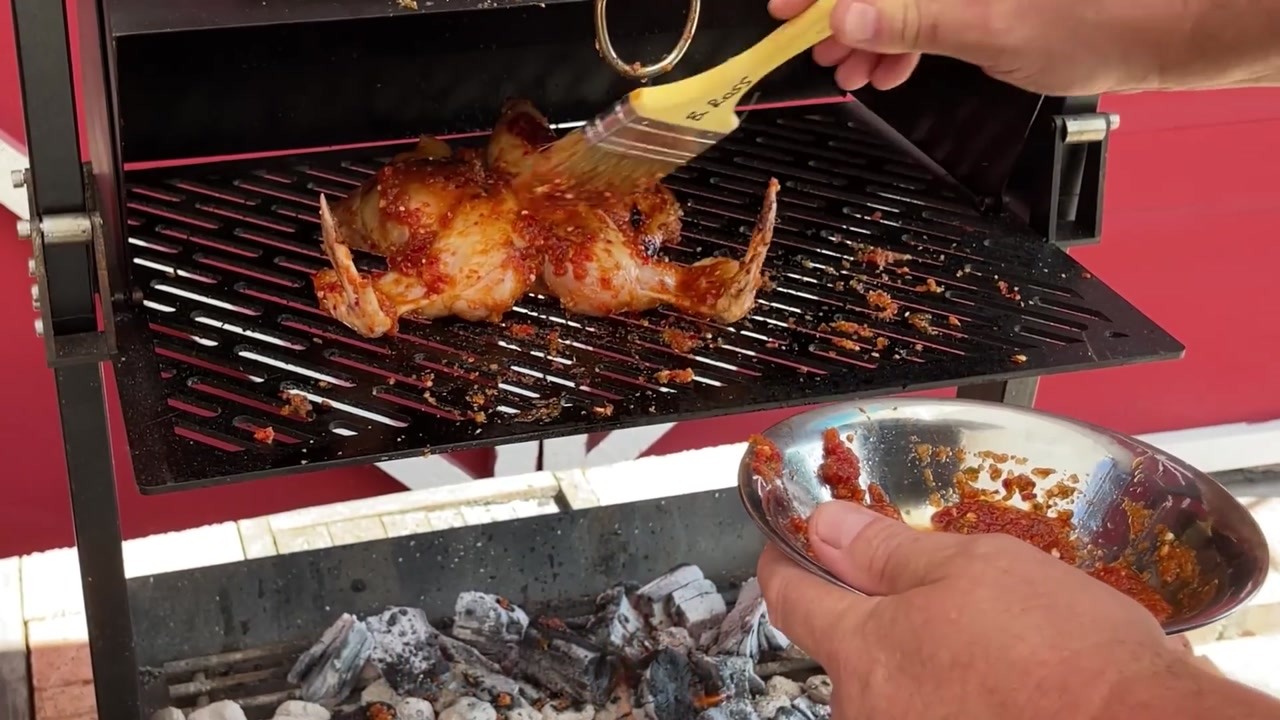 Spatchcock Chili Chicken Cooks Flat on the Grill With Pepper Baste