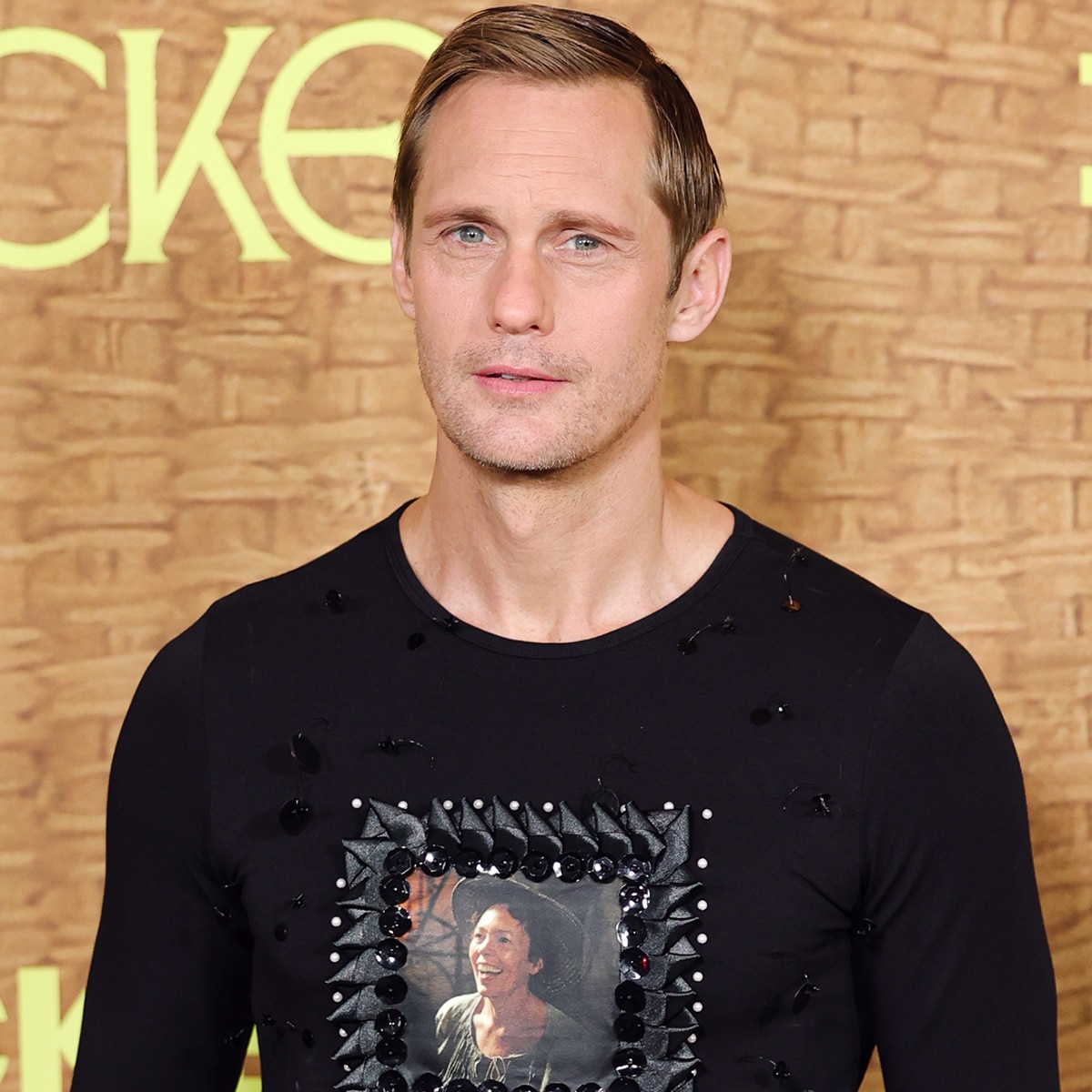Alexander Skarsgård weaves Olivia Colman’s face into red carpet look