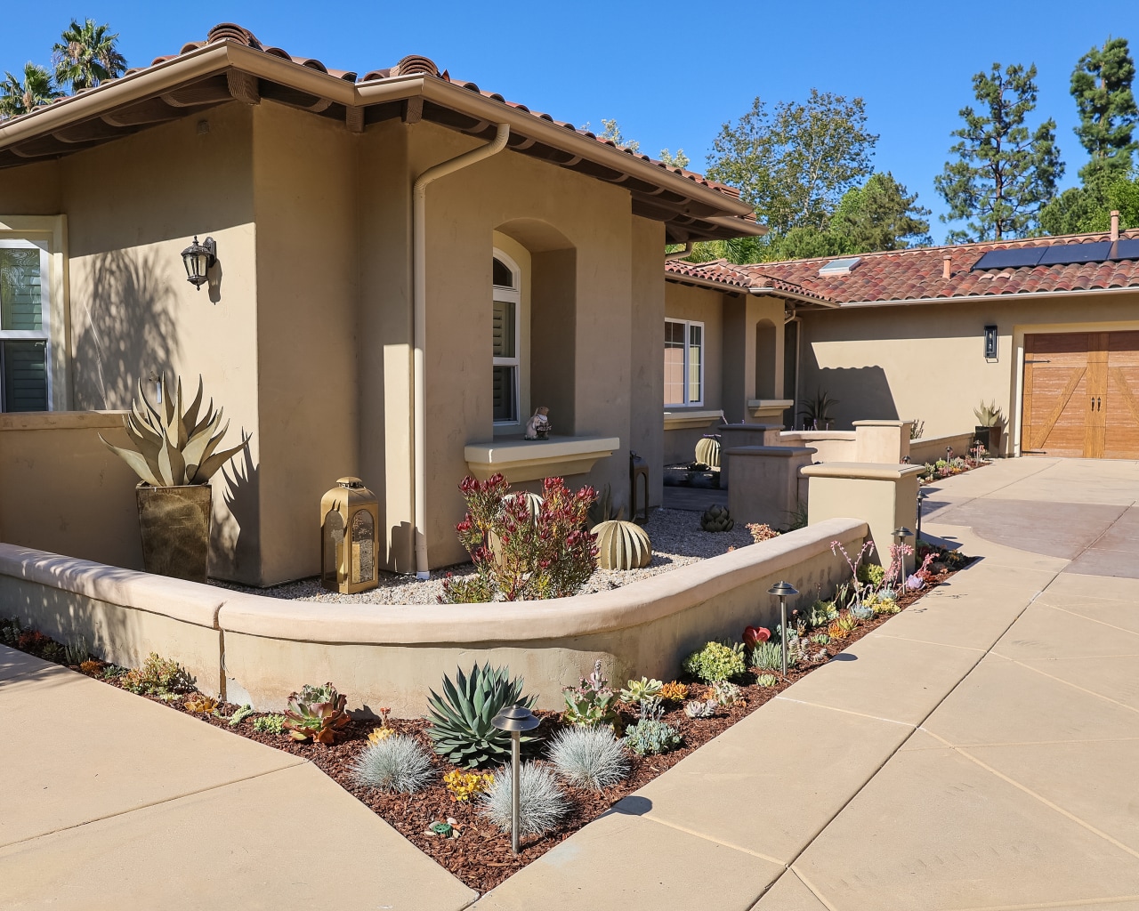 Californians are warding off wildfires by trading lush lawns for stone and steel