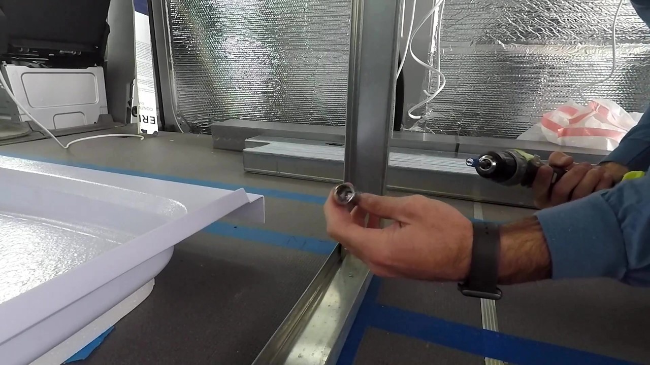 A sprinter van gets a shower frame with 2-1/2-inch steel studs