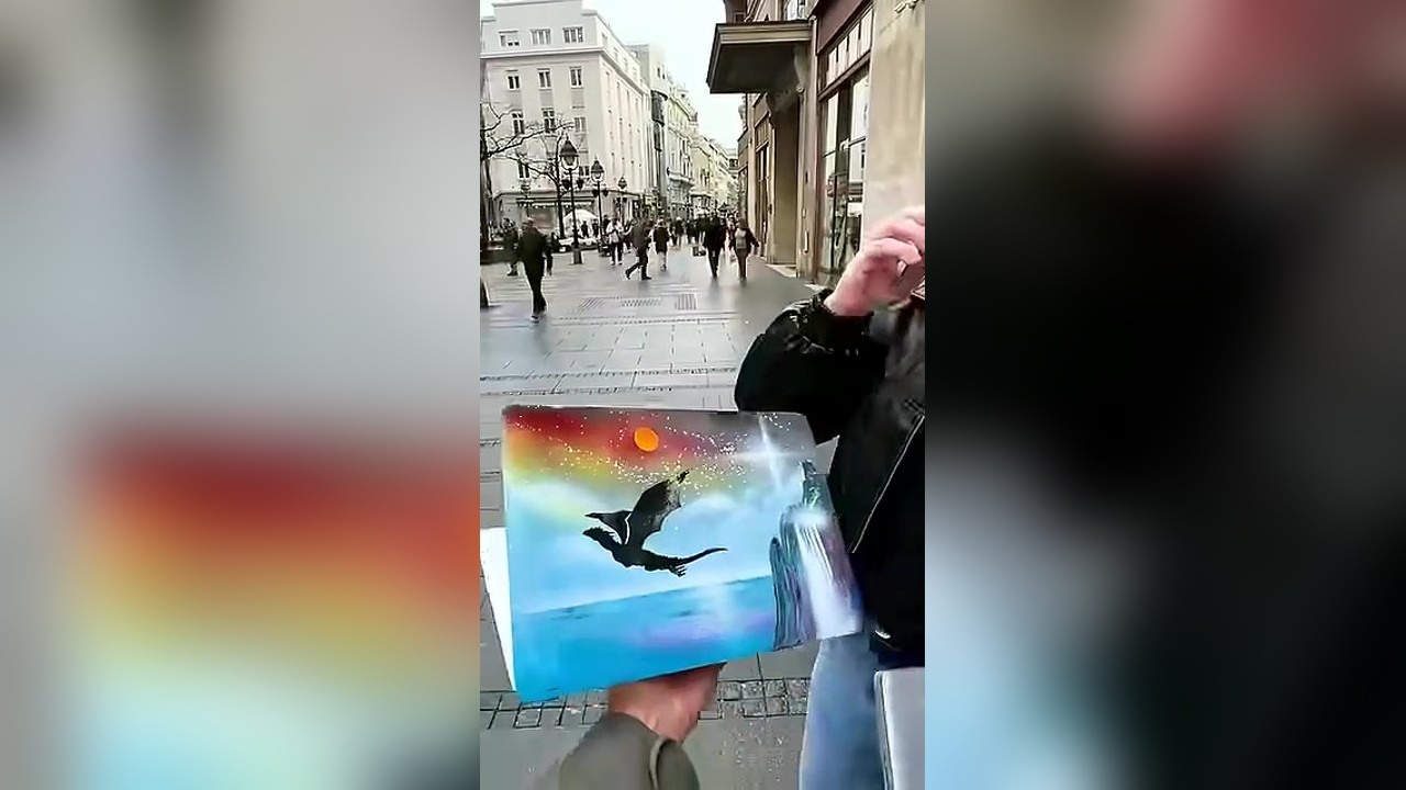 Strangers hand over their laptops for spray painting
