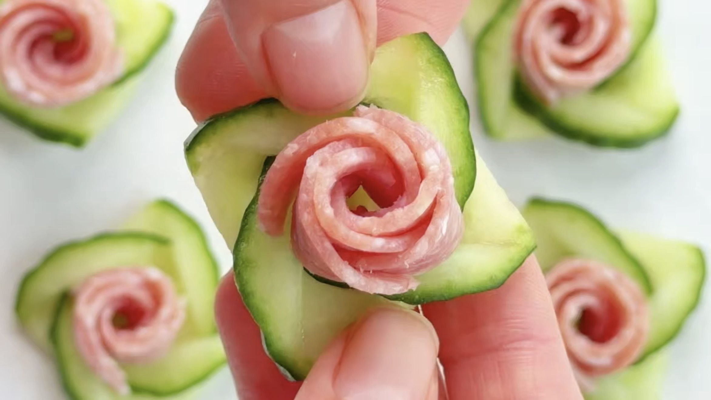 Twisted cucumber roses with salami filling