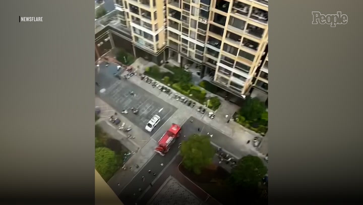 Terrifying video shows 3-year-old girl dangling from 12th-floor window ...