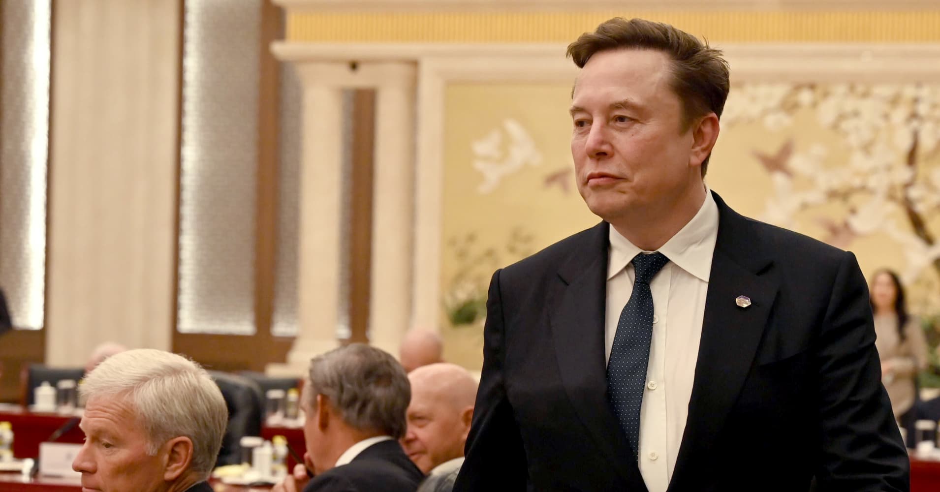 Tesla beats on earnings and sales even as auto revenue declines