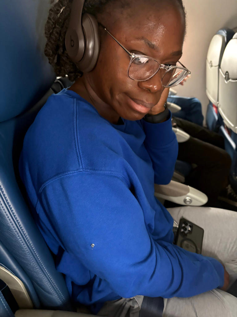 Plane passenger who put earring spike through sleeve in armrest row ...