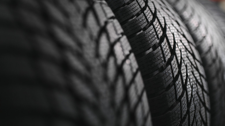 How does tire tread affect braking distance?
