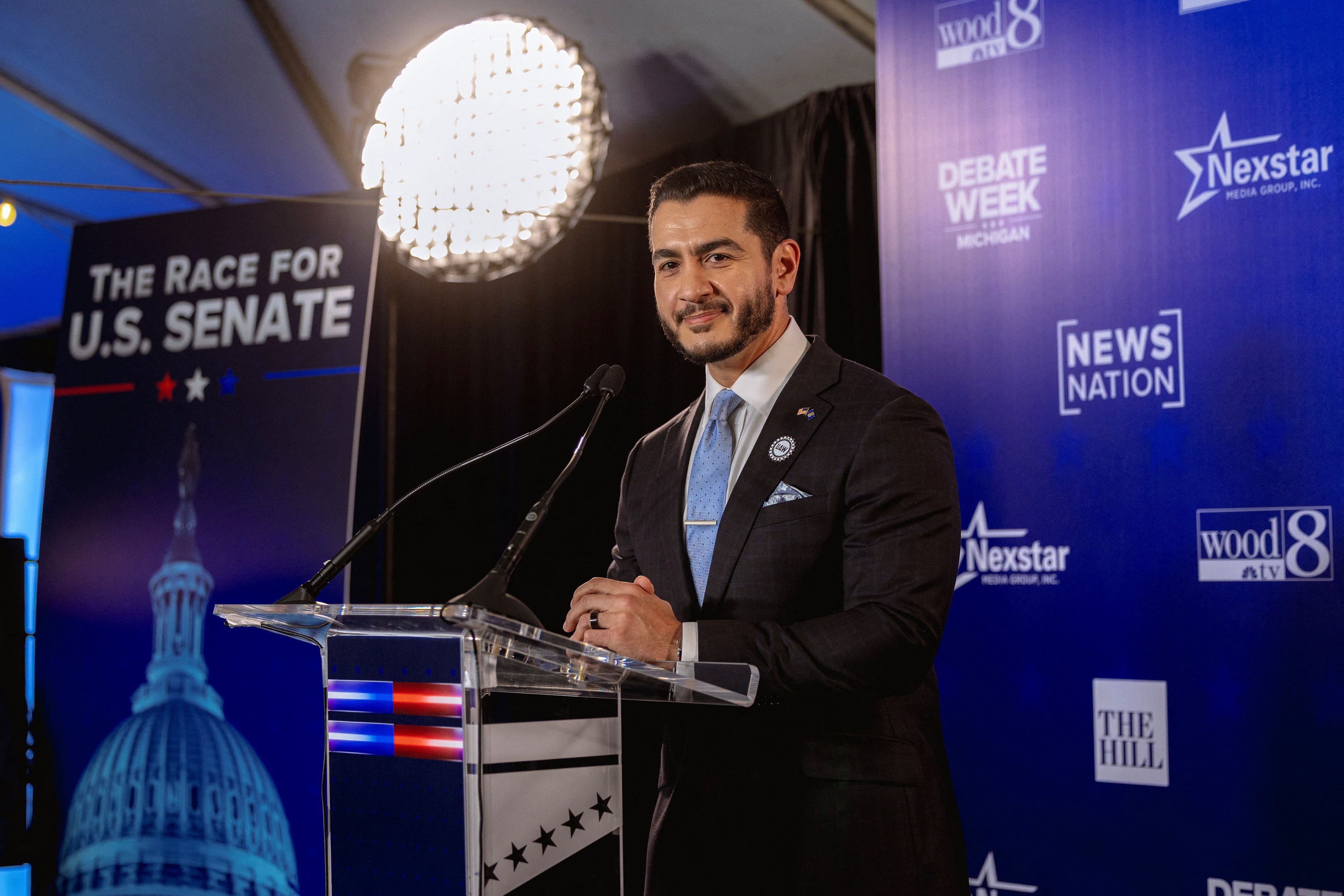 Democratic US Senate candidate Abdul El-Sayed looks on while speaking to the press in the spin room after taking part in a debate with Republican rival candidate Mike Rogers, in Grand Rapids, Michigan, US, October 8, 2026.