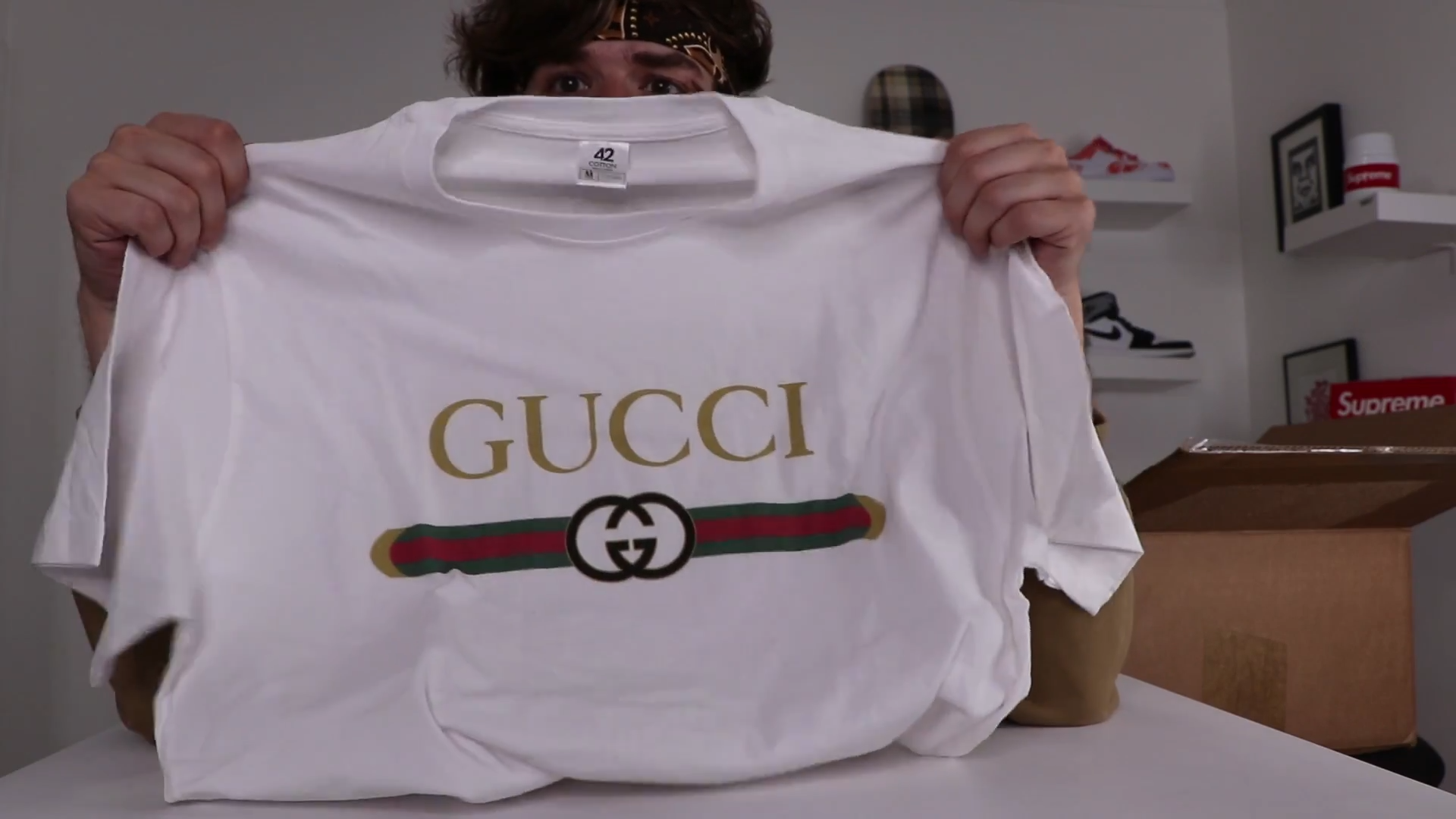 Connor opens a Wish box with imitation Gucci tees and streetwear