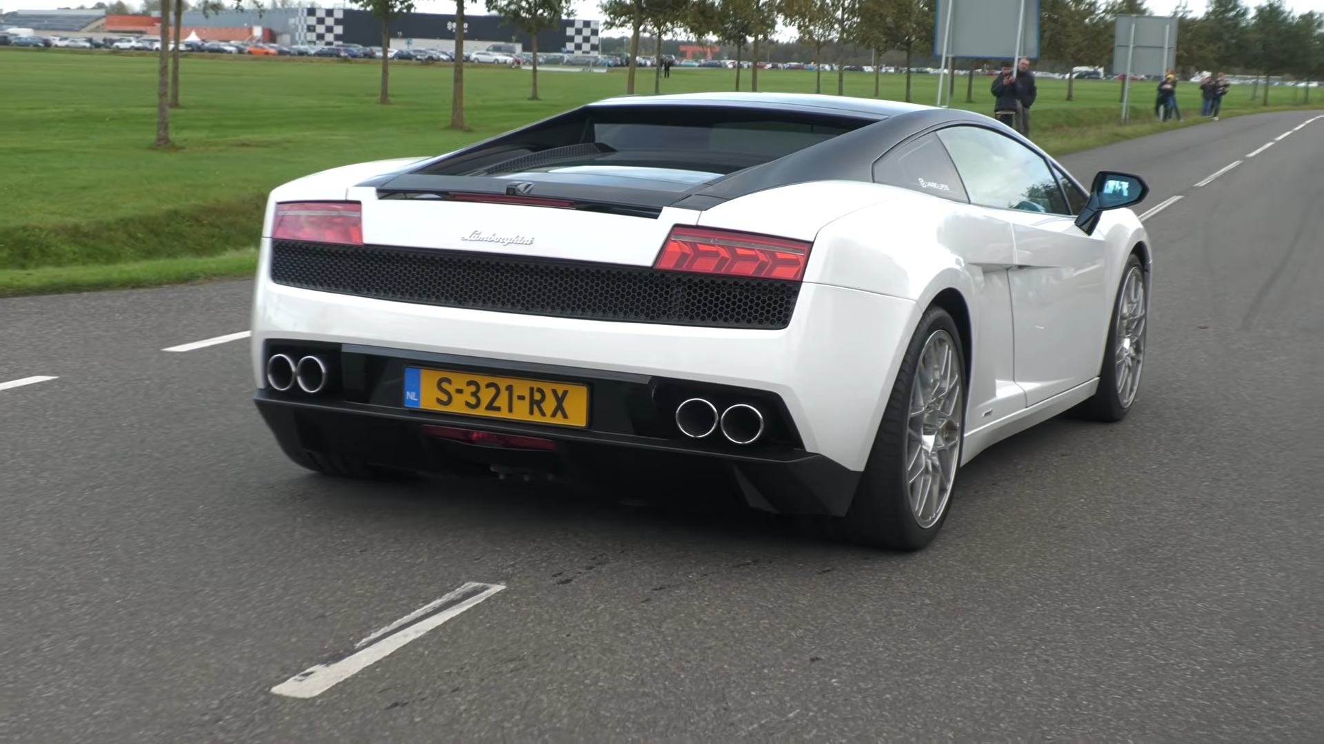 Modified cars and supercars leaving TT Circuit Assen show