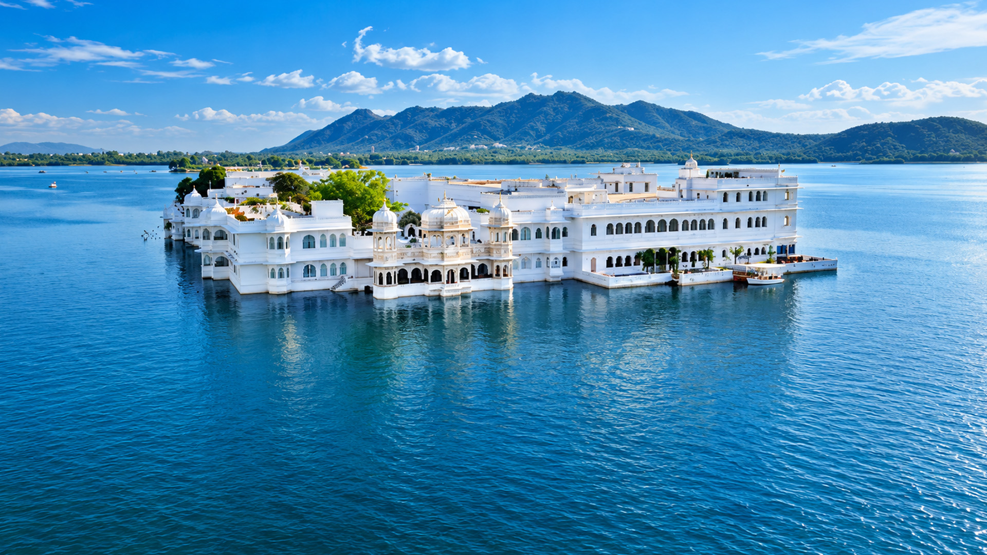 A white marble palace appears to float on water