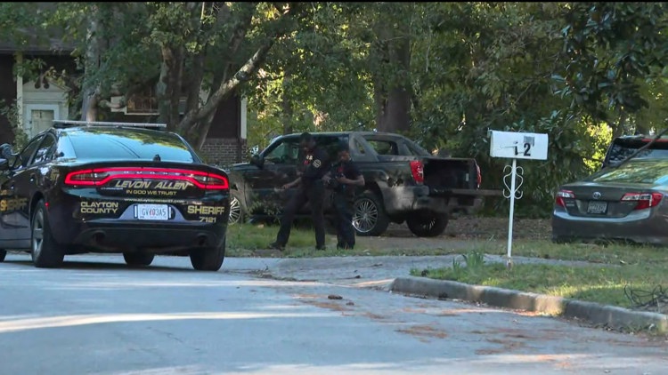 Officer injured after being dragged by a car in Clayton County, search for suspect ongoing