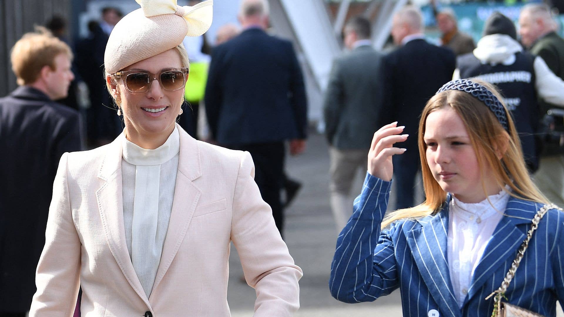 Mia Tindall is mum Zara's mini cheerleader as she patiently waits for a ...