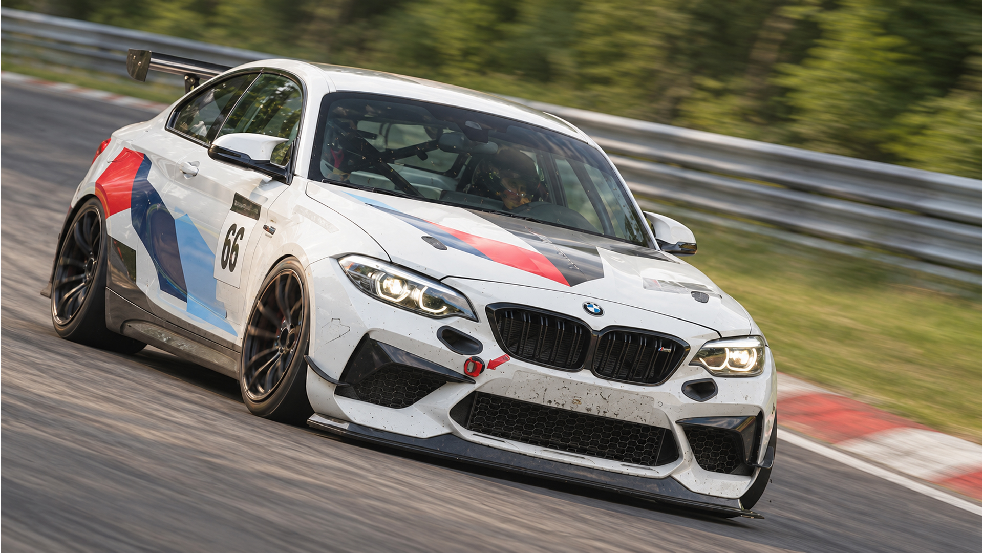 BMW M2 race car hunts the Nürburgring kerbs