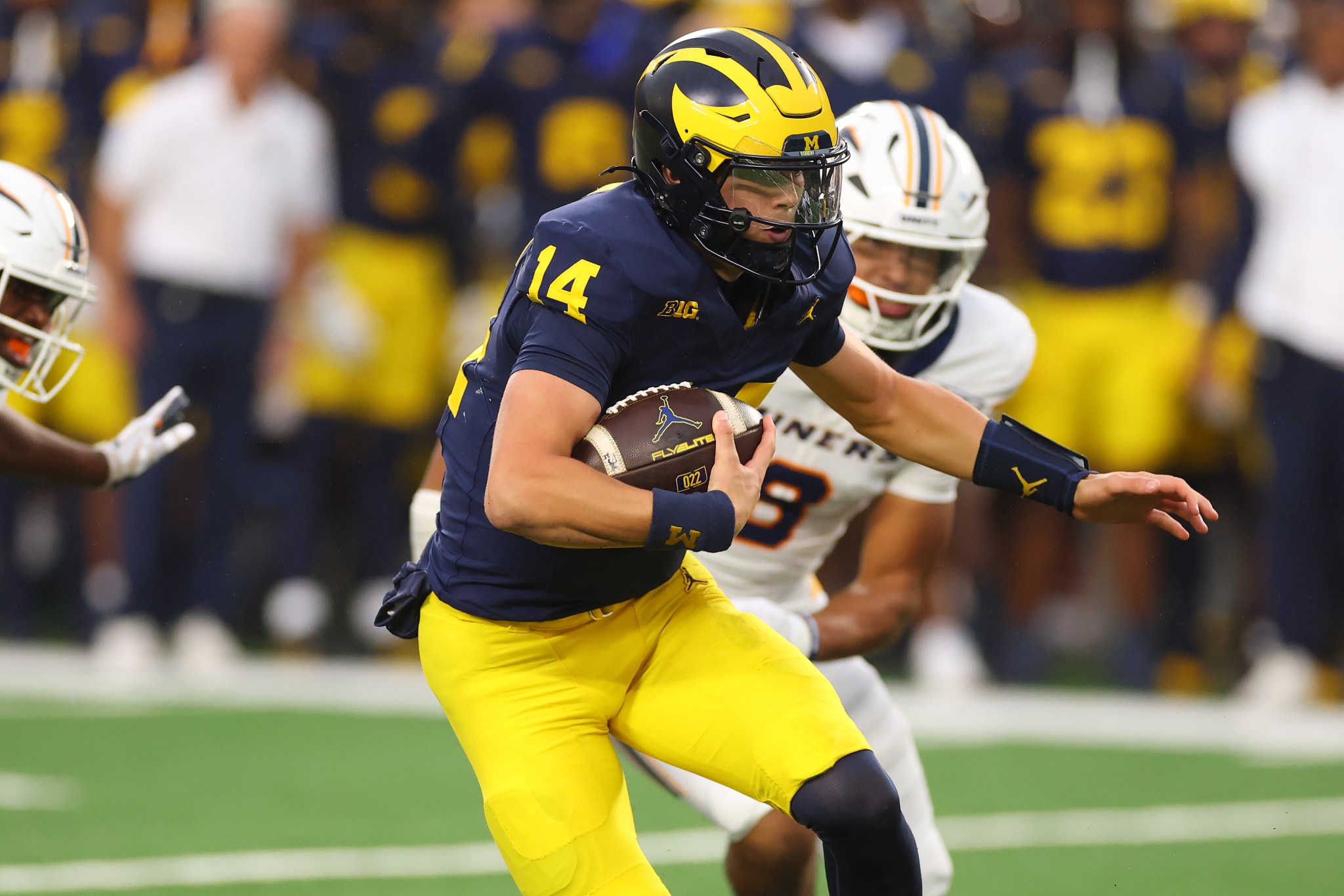Michigan's unexpected QB starter has a famous family connection