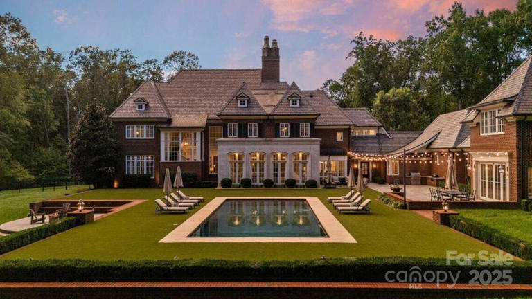 Former NASCAR driver's lake mansion with a dock, four garages and 33.6 ...