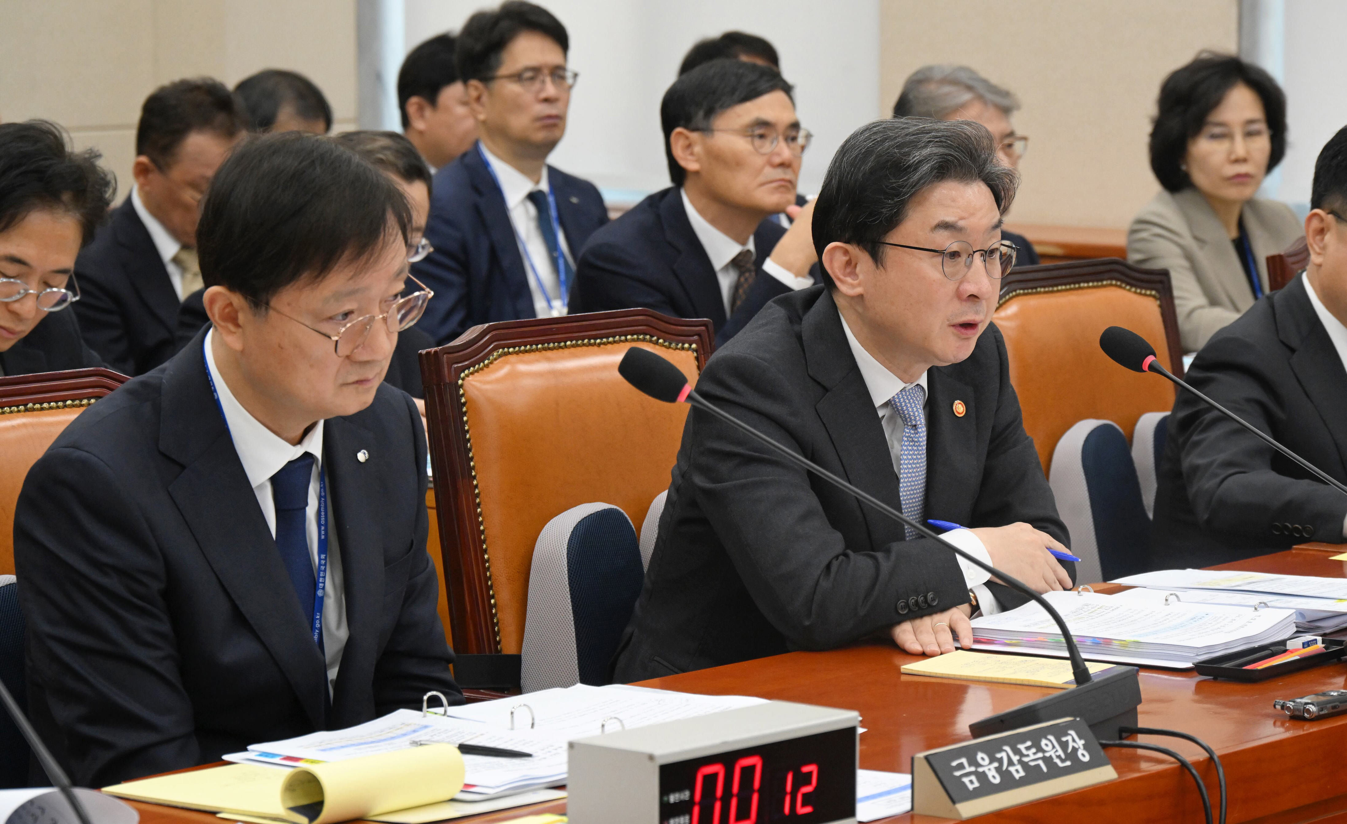 Financial chiefs apologize for 6.3T won losses, reject rushed approval