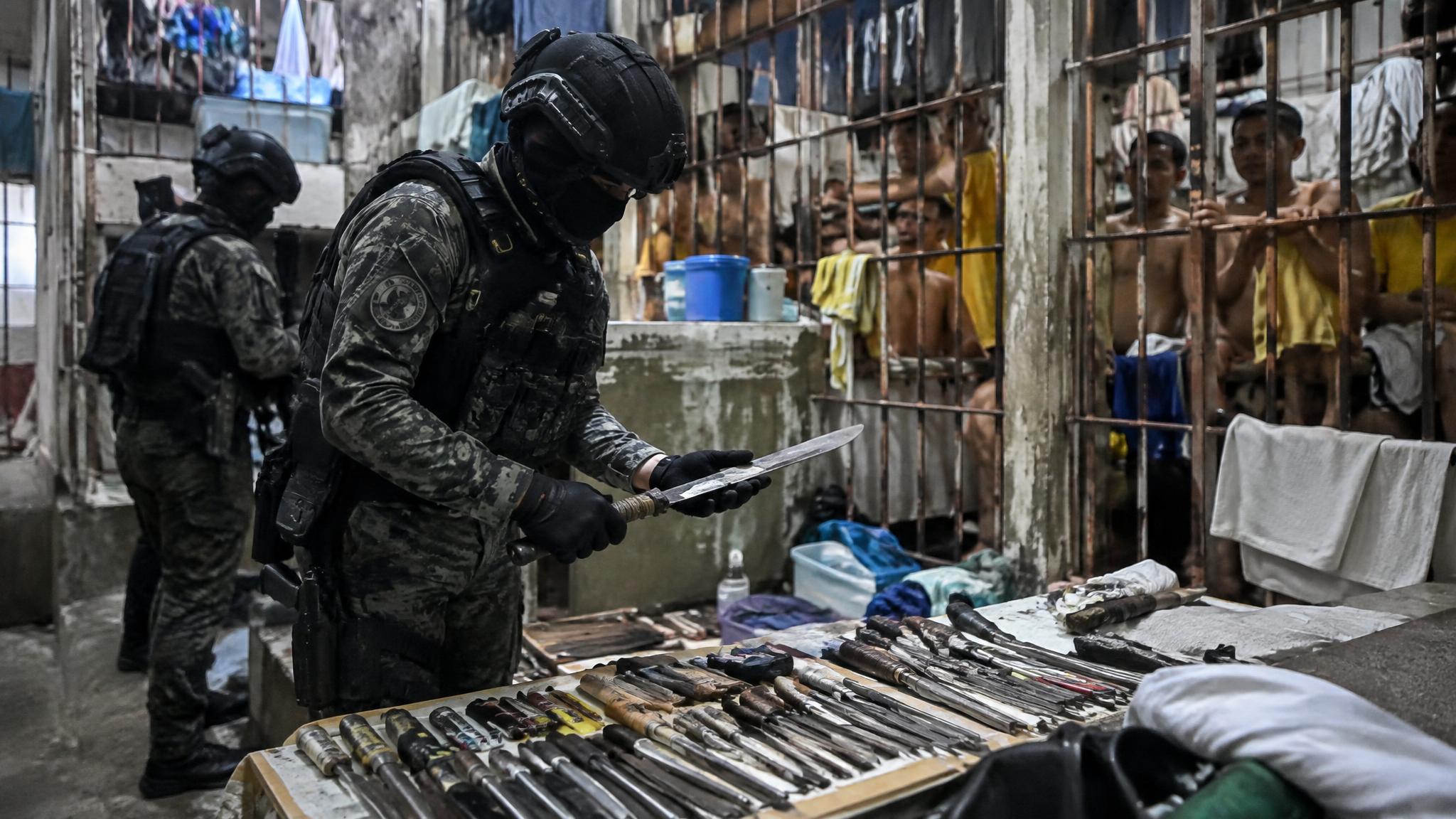 A secret national police raid exposes scores of contraband weapons ...