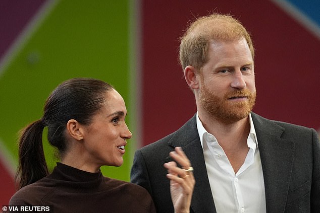 Volunteer who ignored Meghan Markle revealed as millionaire