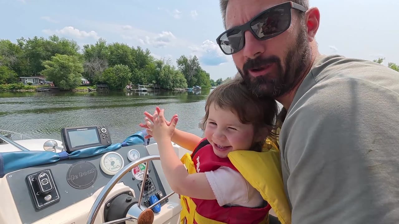 Family navigates a massive boat lift with a toddler and nervous dog
