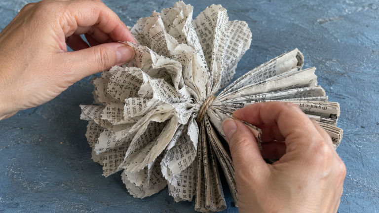How to turn old newspapers into pretty paper pom-poms