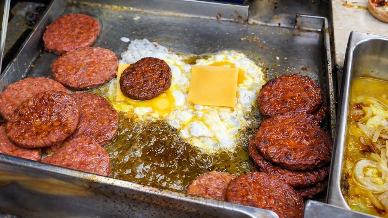 Watching a Malaysian Ramly burger being cooked with extra oil and butter