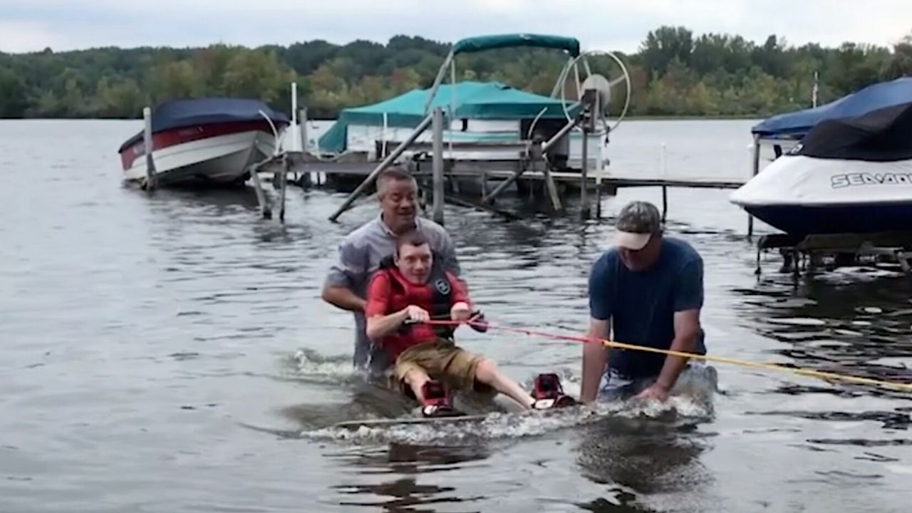 Man with cerebral palsy wakeboards for first time | Happily