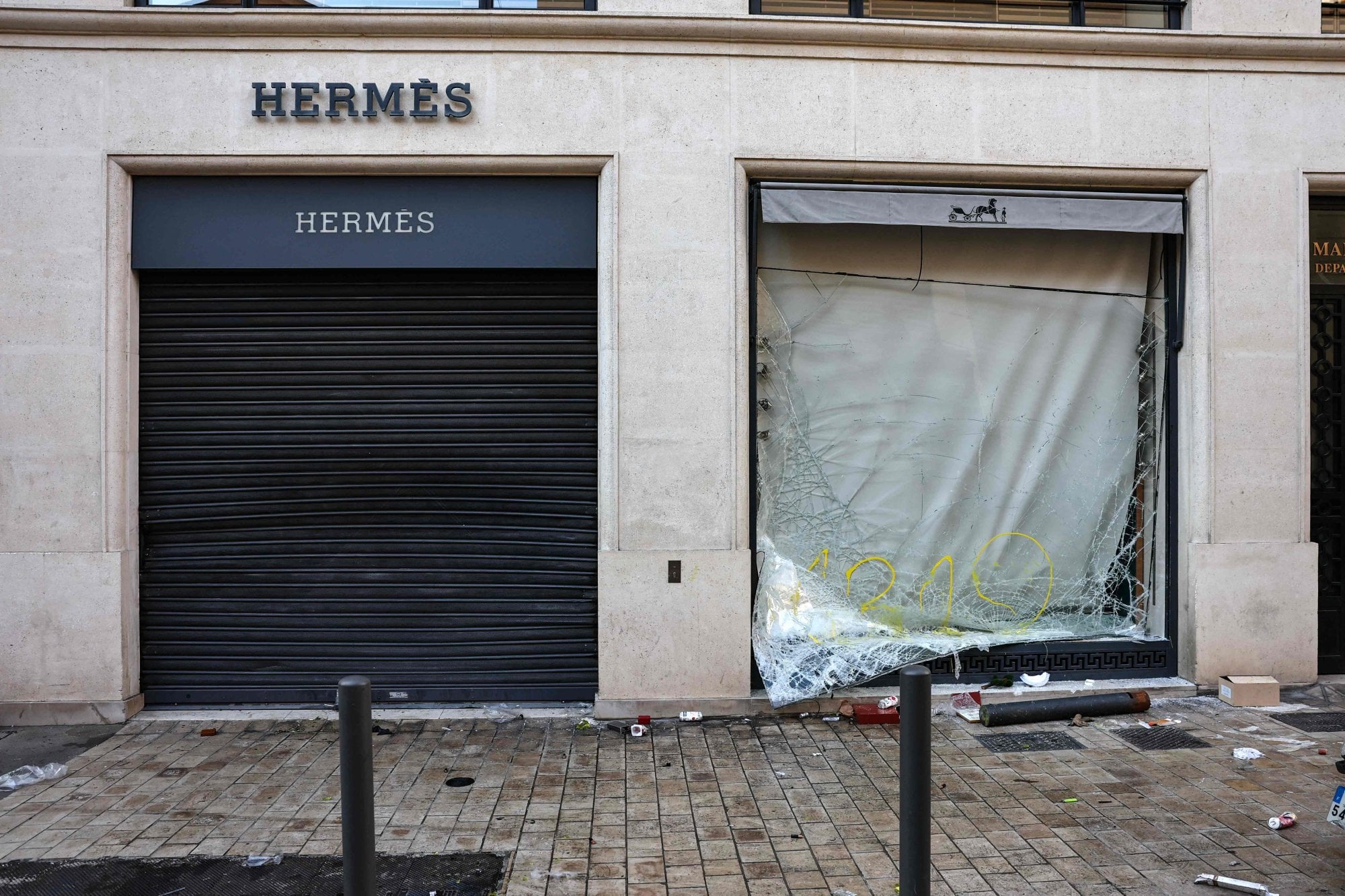 Riot-ravaged luxury stores in Paris fear more mayhem, looting