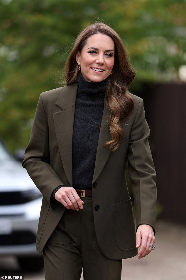 Her royal hugness! Kate gets a cuddle as she meets children with life ...