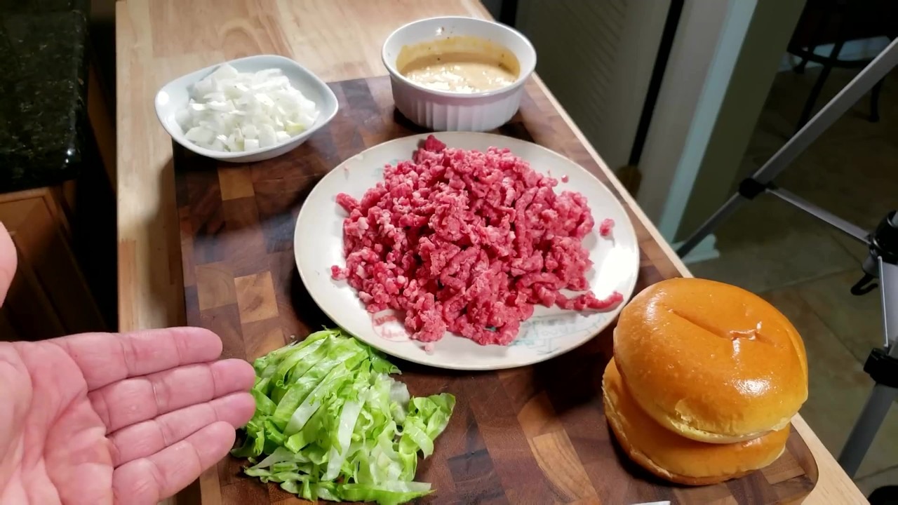 Tommy grinds beef backbones and chuck for a Blackstone cheeseburger