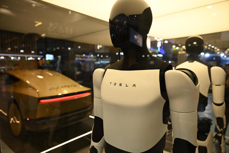 Elon Musk says training Tesla's Optimus robot is like raising a toddler