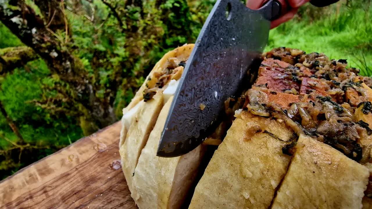 Oversized cheese and garlic bread prepared in an ASMR cooking session