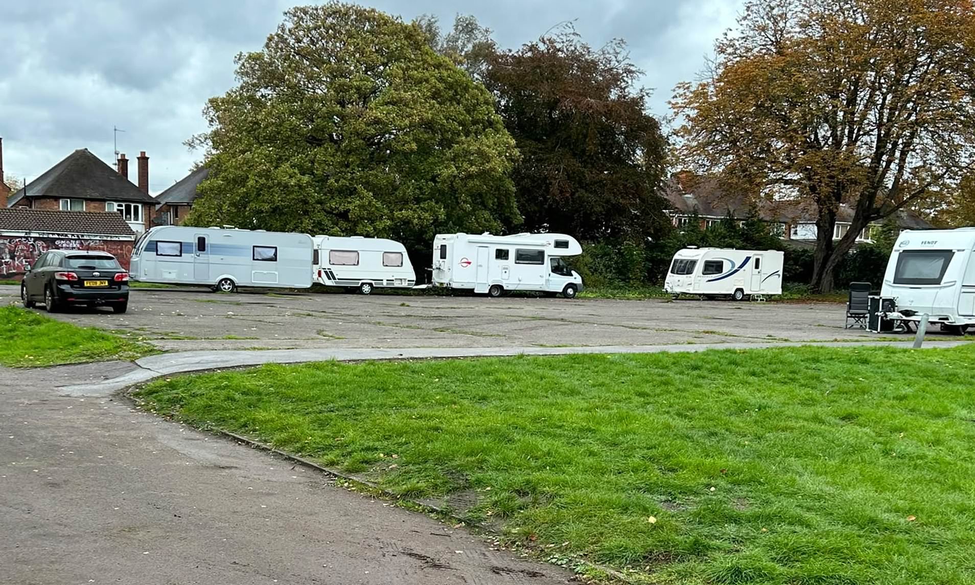 Travellers smash through gates and set up camp in public park for fifth ...