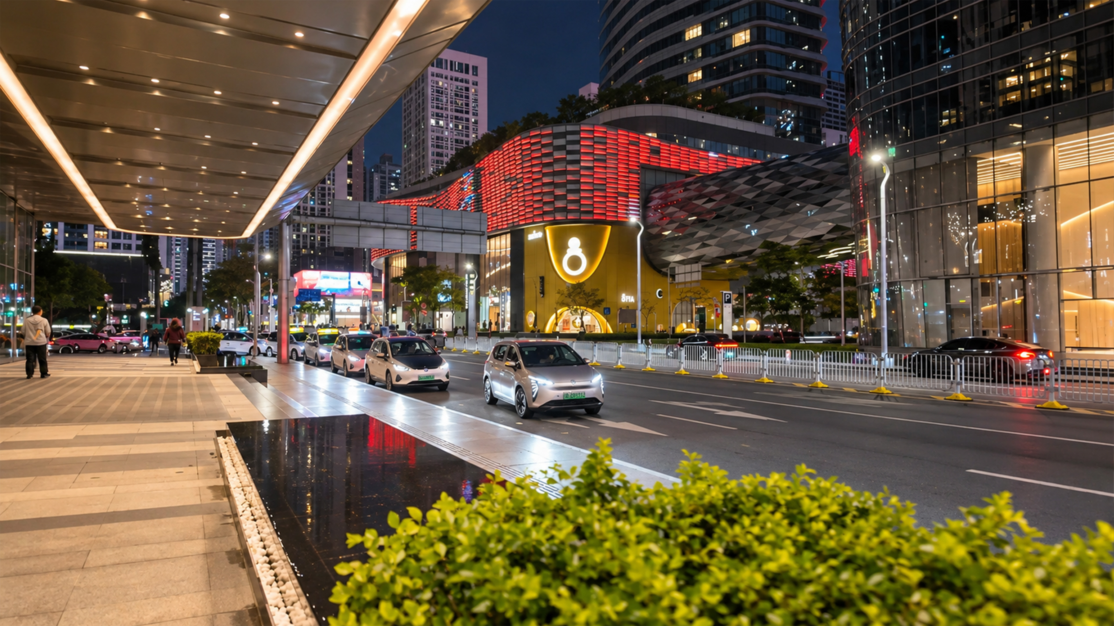 A massive geometric canopy extends from Shenzhen's red shopping complex