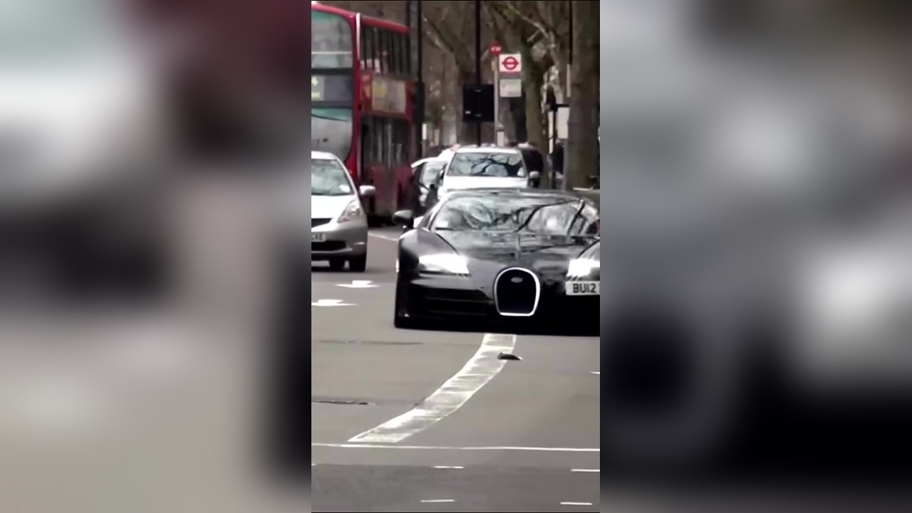 Pedestrian makes Bugatti driver reverse at a crossing