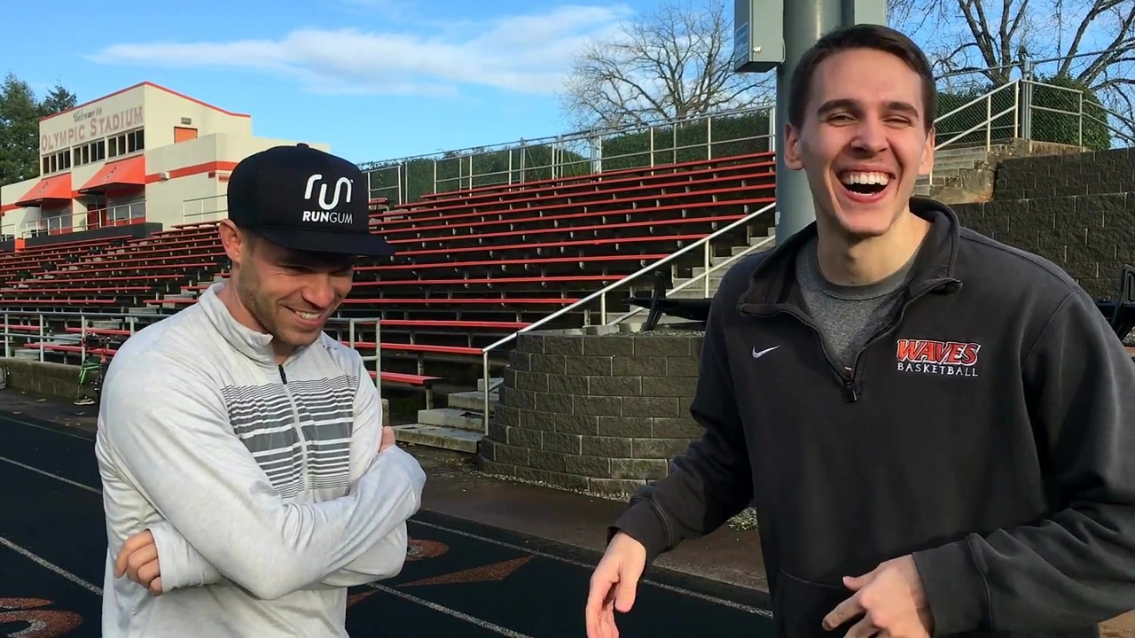 Nick Symmonds tapes his arms for a 100m race against a D1 basketball player