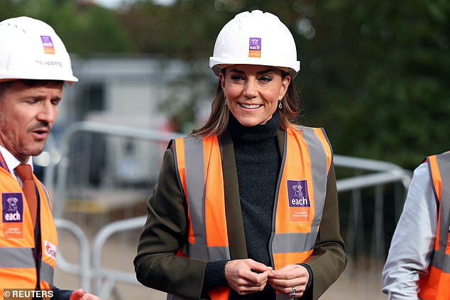 Her royal hugness! Kate gets a cuddle as she meets children with life ...