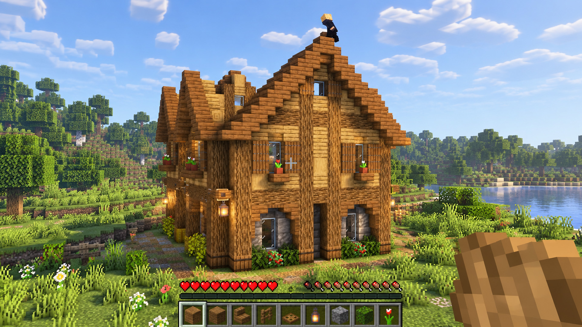 This Minecraft wooden mansion brings rustic charm to a peaceful lakeside