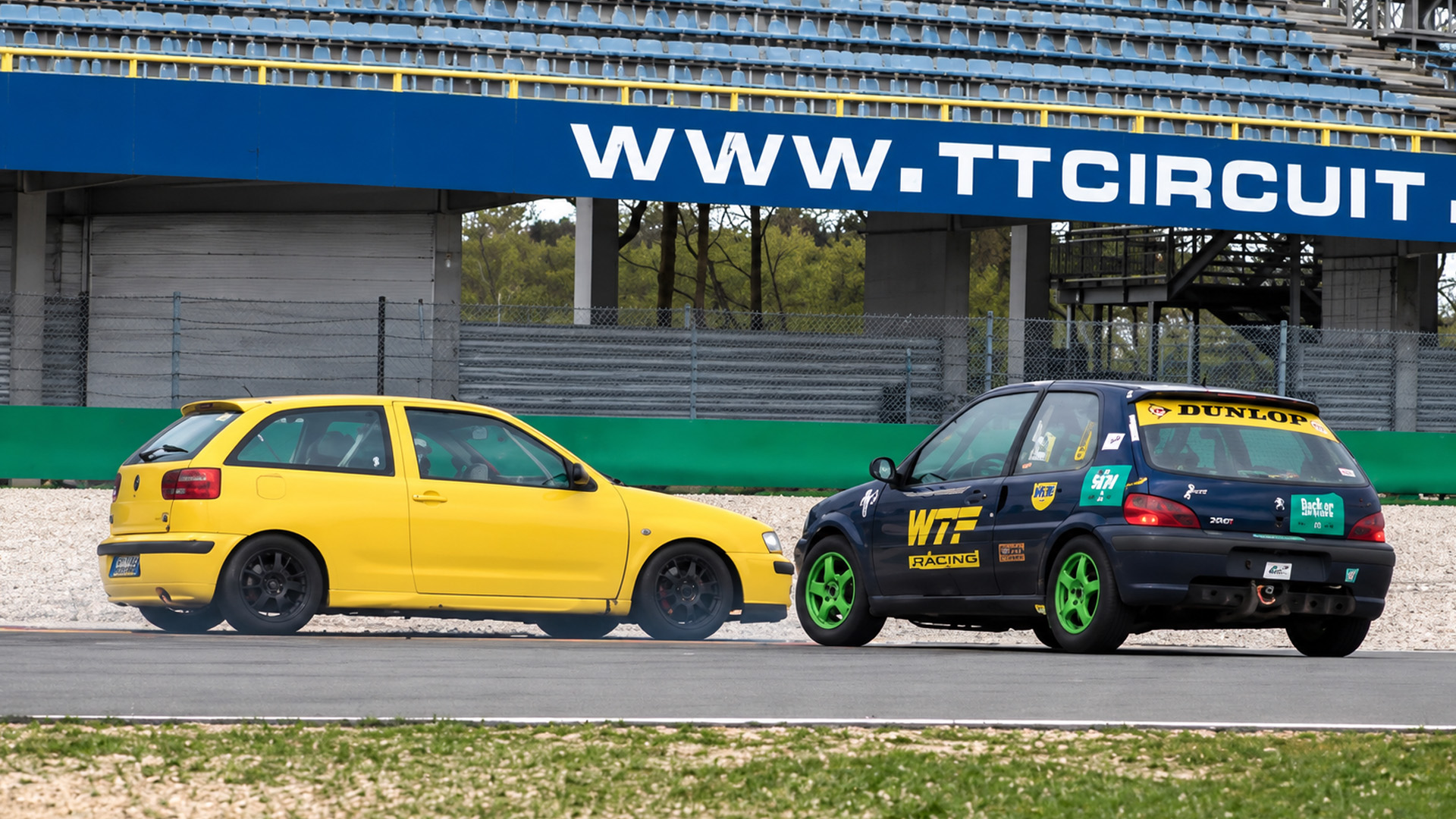Hatchback loses control near another car during track day