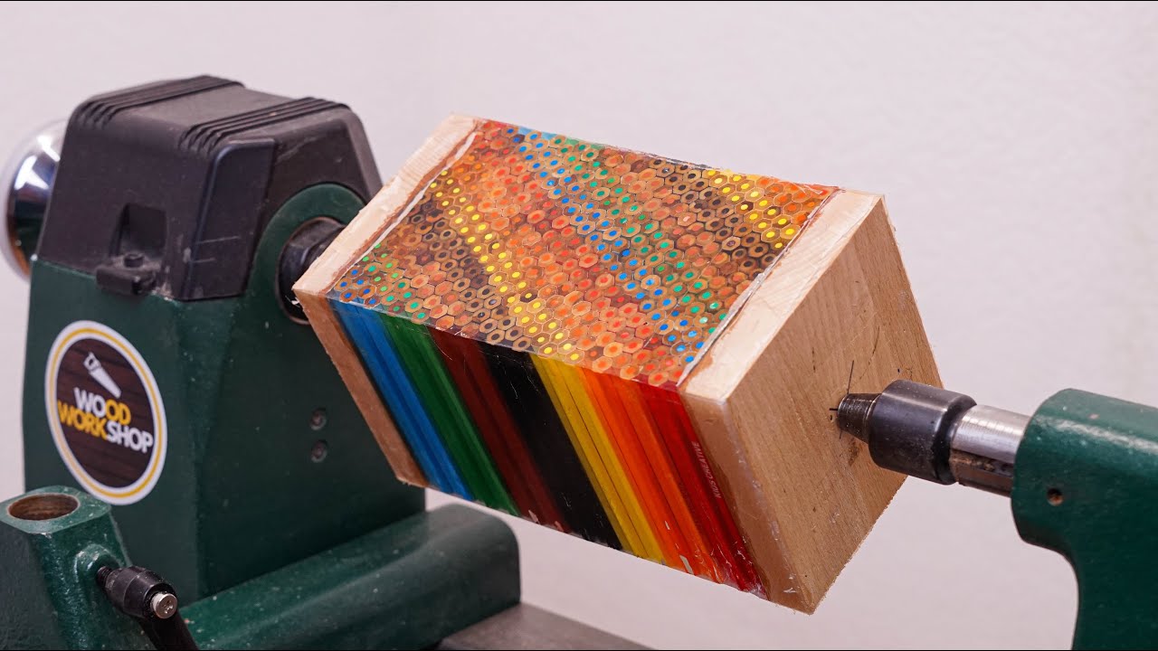 Woodworker turns diagonal rainbow pencils into a high-gloss vase