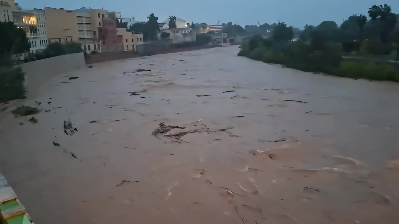 Serpis River overflows its banks following torrential rainfall in ...