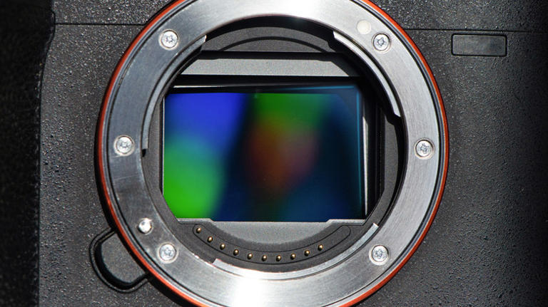 Should you clean both sides of a camera lens?