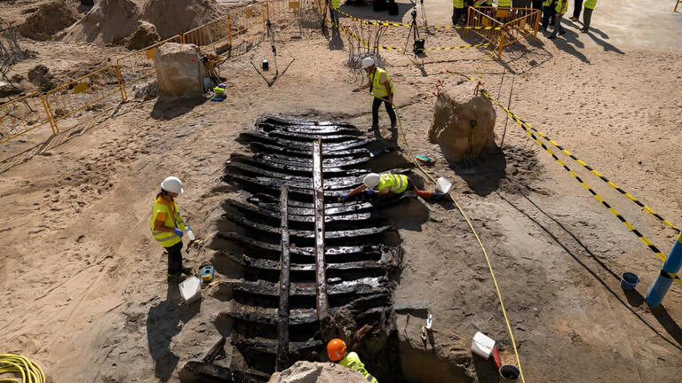 Construction workers unearth a 500-year-old ship buried beneath ...