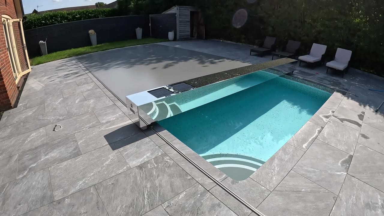 New Pool Safety Cover Slides Across the Water on Tracks Built Into the ...