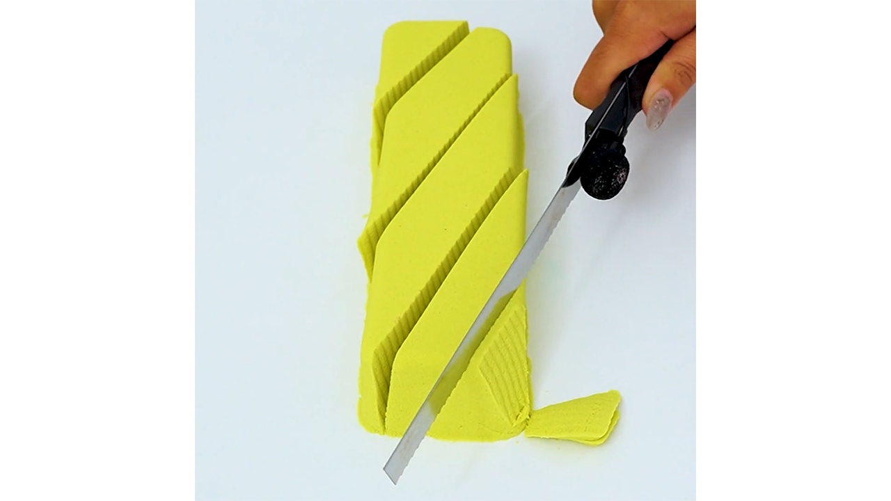 Satisfying slicing yellow sand block with knife creating clean diagonal ...