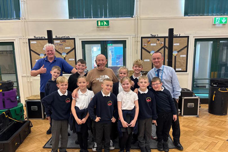 Status Quo drummer Jeff Rich gives pupils at Tyneside primary school a ...
