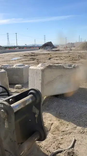 Excavator helps expose massive bee nest under concrete block