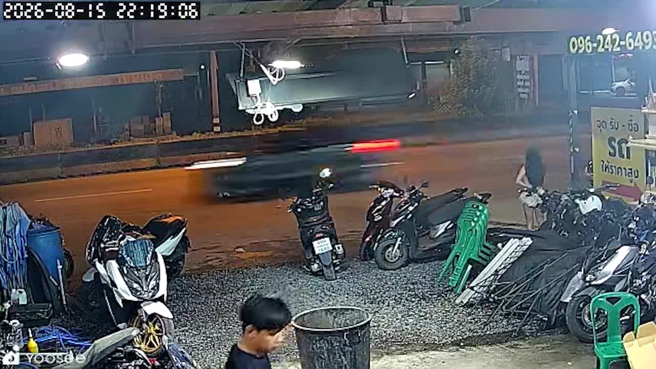 Woman knocked down by falling sign after crash outside Thai repair shop