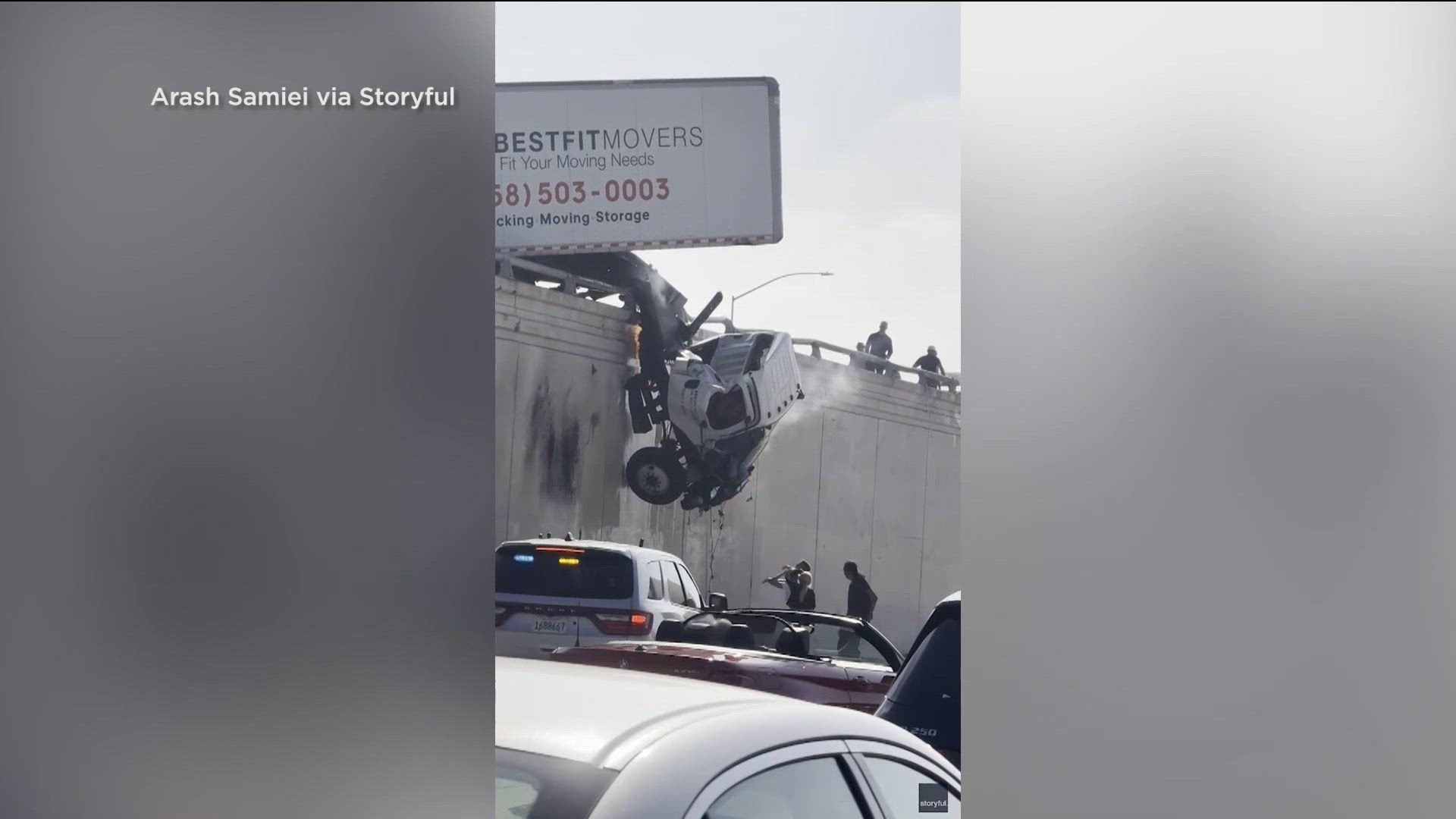 Bystanders rush to help semi-truck driver hanging off I-5 freeway